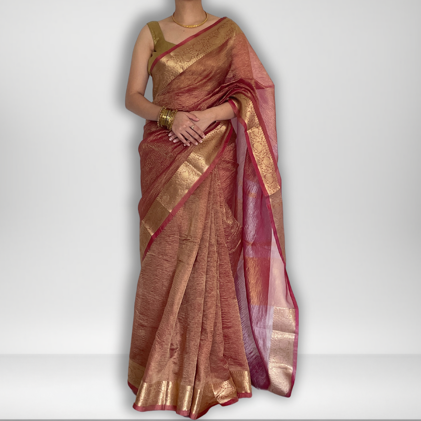 Pink crush tissue saree with Banarasi border and golden zari work, Work by Shobhangini. Elegant pink saree, perfect for feminine charm.