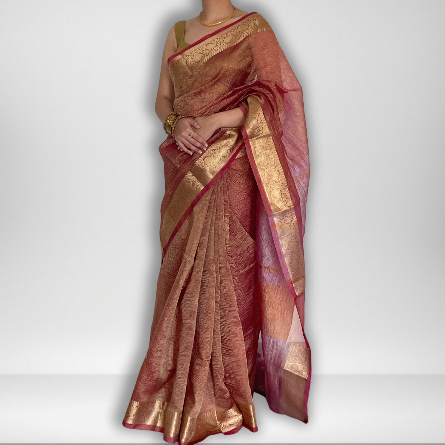 Pink crush tissue saree with Banarasi border and golden zari work, Work by Shobhangini. Elegant pink saree, perfect for feminine charm.