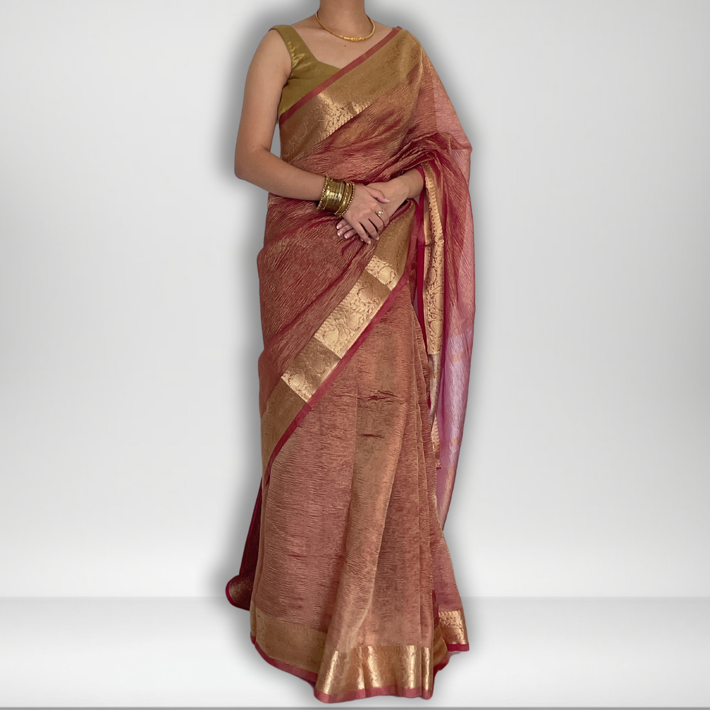 Pink crush tissue saree with Banarasi border and golden zari work, Work by Shobhangini. Elegant pink saree, perfect for feminine charm.