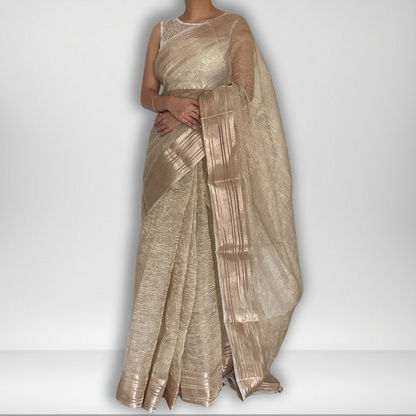 Light gold metallic crush tissue saree with copper zari border, Work by Shobhangini. Delicate light gold saree, perfect for day events.