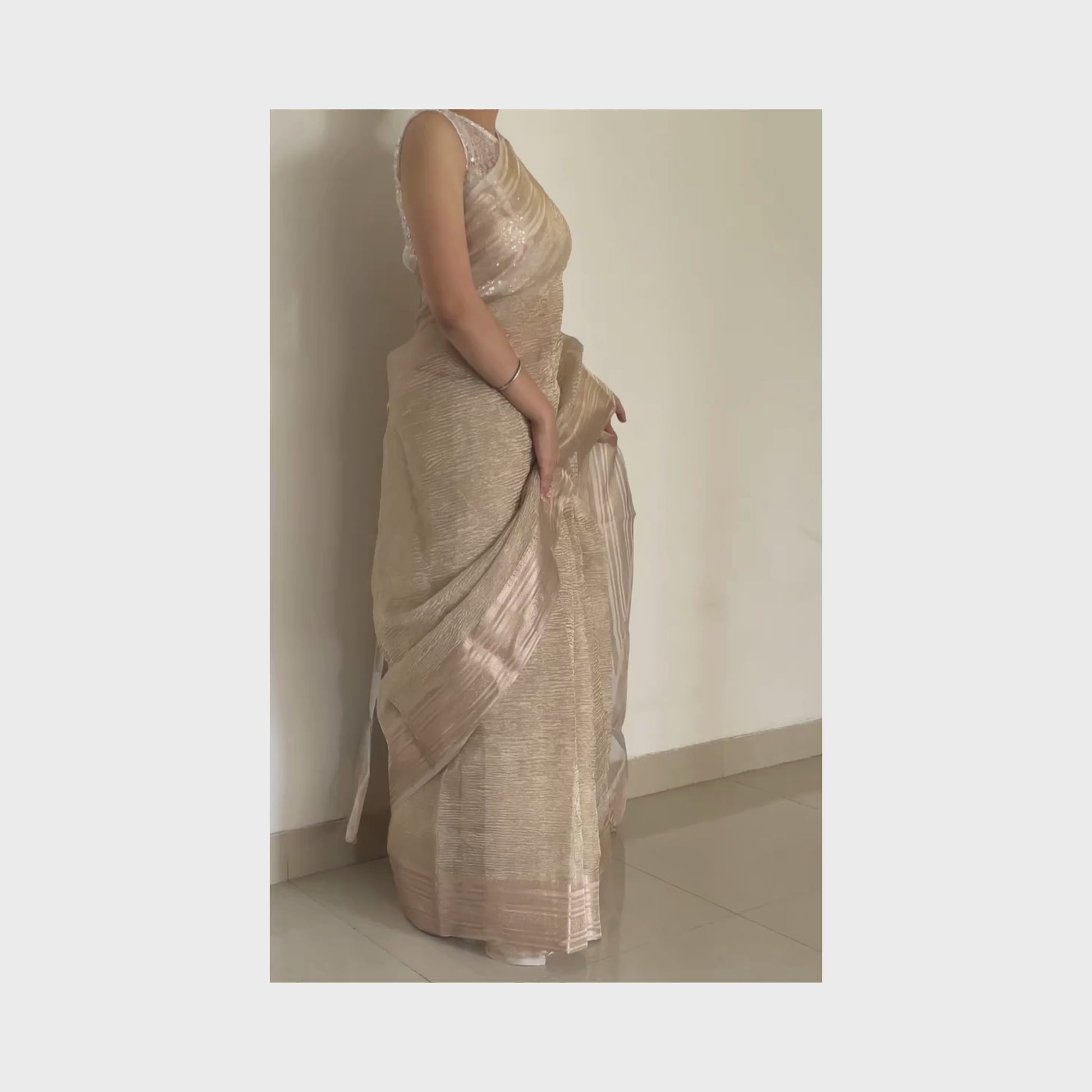Light gold metallic crush tissue saree with copper zari border, Work by Shobhangini. Delicate light gold saree, perfect for day events.