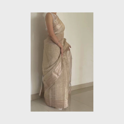 Light gold metallic crush tissue saree with copper zari border, Work by Shobhangini. Delicate light gold saree, perfect for day events.